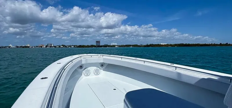  Yacht Photos Pics 2022 Contender 39 ST boat on blue water under a clear sky.