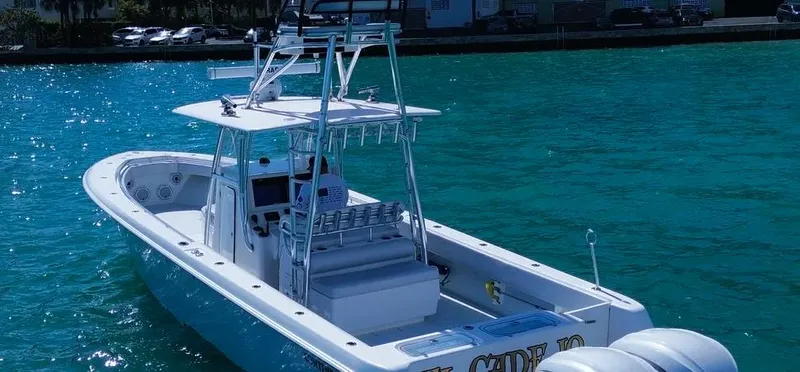  Yacht Photos Pics 2022 Contender 39 ST boat on clear blue water, featuring sleek design and modern equipment.