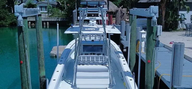  Yacht Photos Pics 2022 Contender 39 ST boat docked, featuring advanced navigation equipment and sleek design.