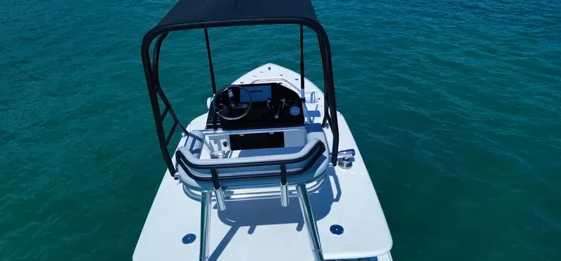  Yacht Photos Pics 2022 Contender 39 ST boat on clear blue water, featuring a sleek design and modern console.