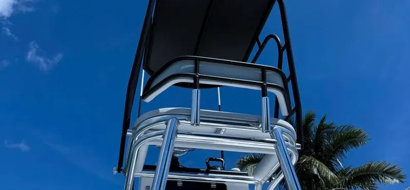  Yacht Photos Pics 2022 Contender 39 ST boat tower against a clear blue sky with palm trees.