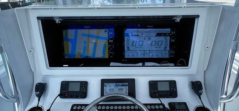 Yacht Photos Pics Control panel of a 2022 Contender 39 ST boat with advanced navigation displays.
