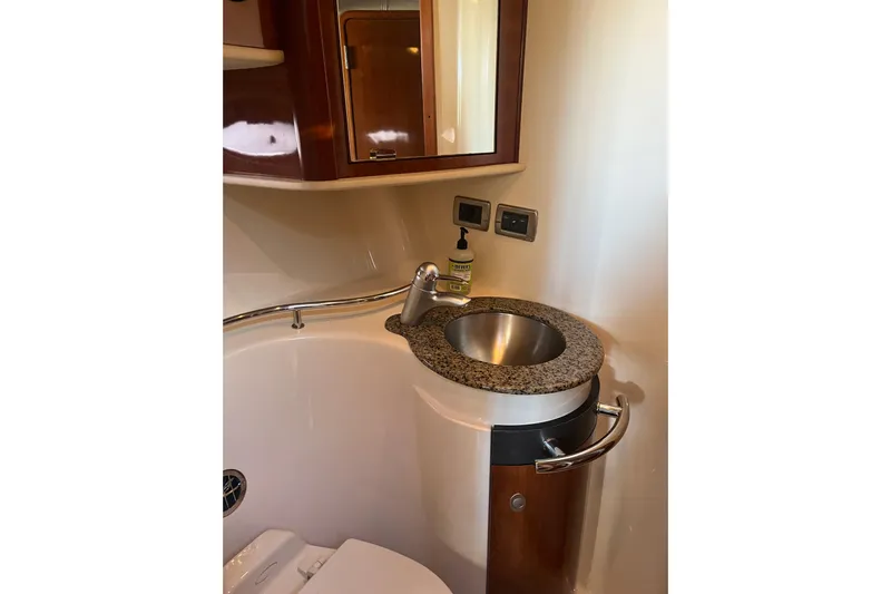  Yacht Photos Pics Bathroom sink area in 2005 Sea Ray 390 Express Cruiser with granite countertop.
