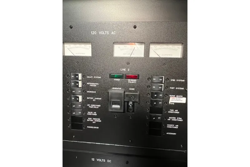  Yacht Photos Pics Electrical panel of 2005 Sea Ray 390 Express Cruiser, showing switches and meters.