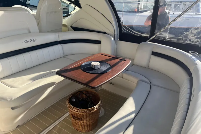  Yacht Photos Pics Luxurious 2005 Sea Ray 390 Express Cruiser interior with elegant seating and wooden table.