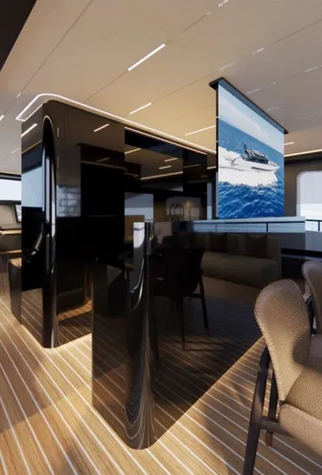  Yacht Photos Pics Luxurious yacht interior with modern design, featuring sleek black surfaces and a large screen.