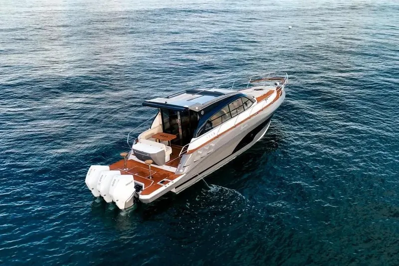  Yacht Photos Pics 2025 Hanover 415 yacht cruising on open water, showcasing sleek design and powerful engines.