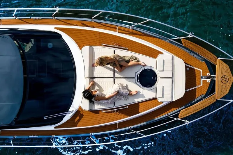  Yacht Photos Pics Aerial view of a Hanover 415 yacht with a person and dog relaxing on deck.