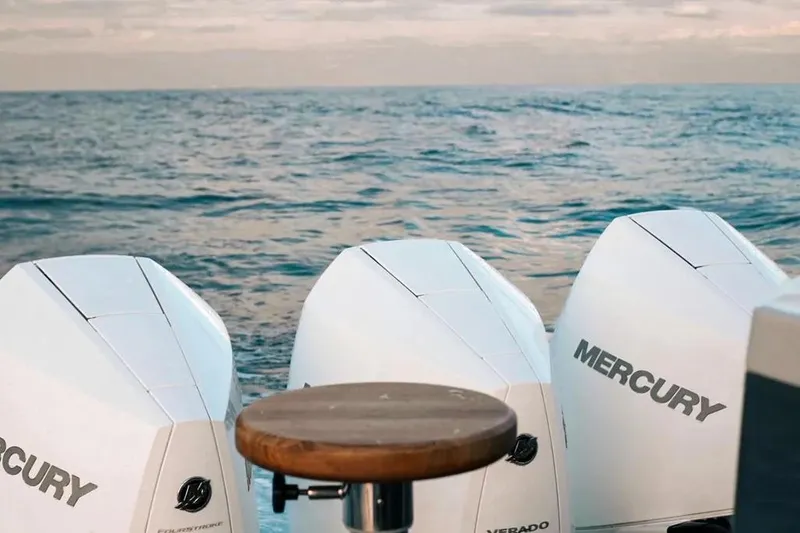  Yacht Photos Pics Three Mercury outboard engines on a Hanover 415 boat, 2025 model, with ocean backdrop.