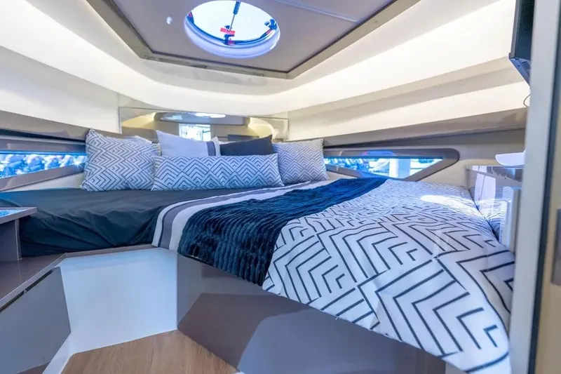  Yacht Photos Pics Luxurious interior of 2025 Hanover 415 yacht with stylish bedding and modern design.