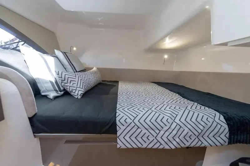  Yacht Photos Pics Luxurious interior of 2025 Hanover 415 yacht with modern bedding and ambient lighting.