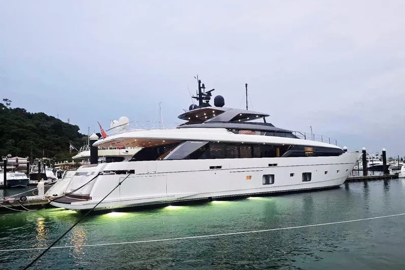  Yacht Photos Pics Luxurious 2022 Sanlorenzo SL 120A yacht docked at marina, illuminated at dusk.