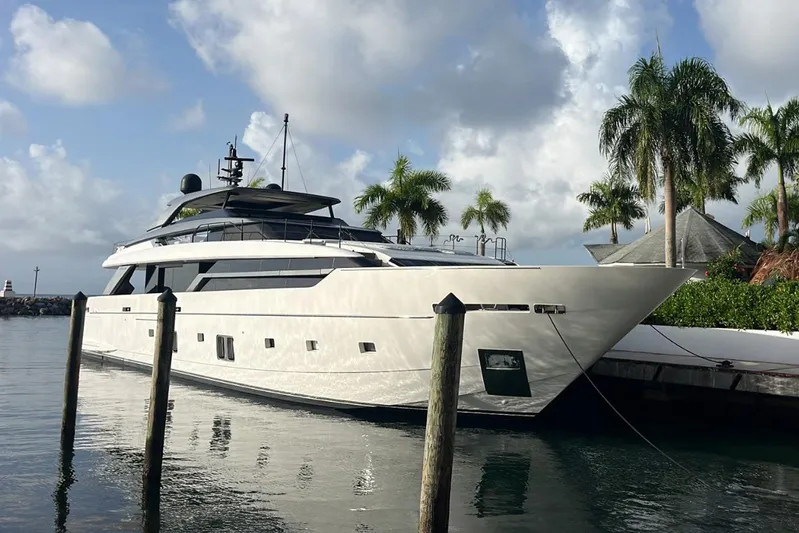  Yacht Photos Pics Luxury Sanlorenzo SL 120A yacht docked, 2022 model, surrounded by palm trees and calm water.