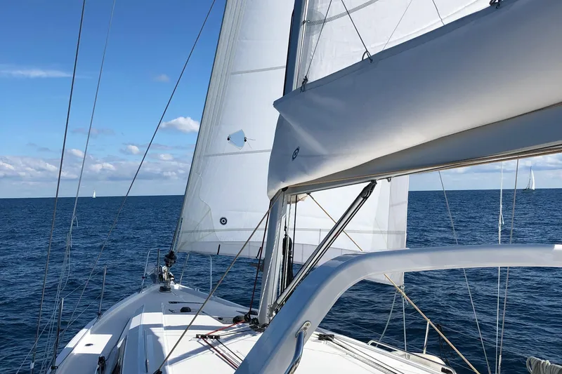 Deli Mavi Yacht Photos Pics 2019 Beneteau Oceanis 41.1 sailing on open sea under clear blue skies.