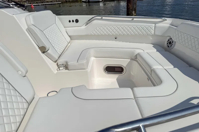  Yacht Photos Pics 2024 Pursuit DC 365 Dual Console boat interior with luxurious white seating and diamond stitching.