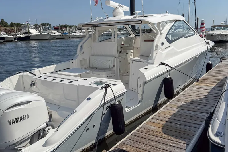  Yacht Photos Pics 2024 Pursuit DC 365 Dual Console boat docked, featuring Yamaha engines and sleek design.