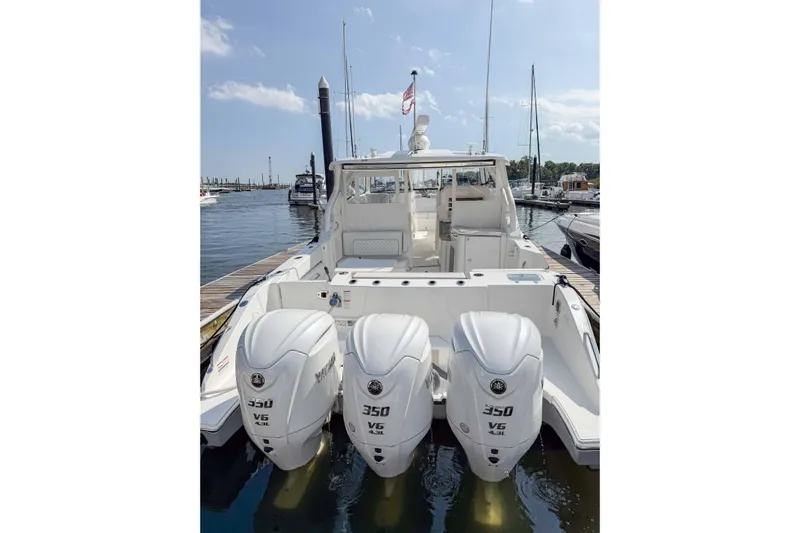  Yacht Photos Pics 2024 Pursuit DC 365 Dual Console boat with triple 350 V6 engines docked at marina.