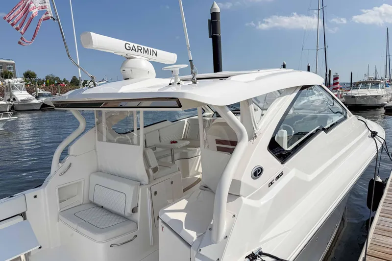  Yacht Photos Pics 2024 Pursuit DC 365 Dual Console boat docked, featuring Garmin equipment and sleek design.