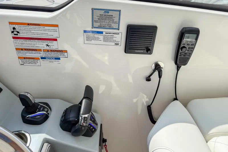  Yacht Photos Pics 2024 Pursuit DC 365 Dual Console boat controls with Garmin speaker and communication device.