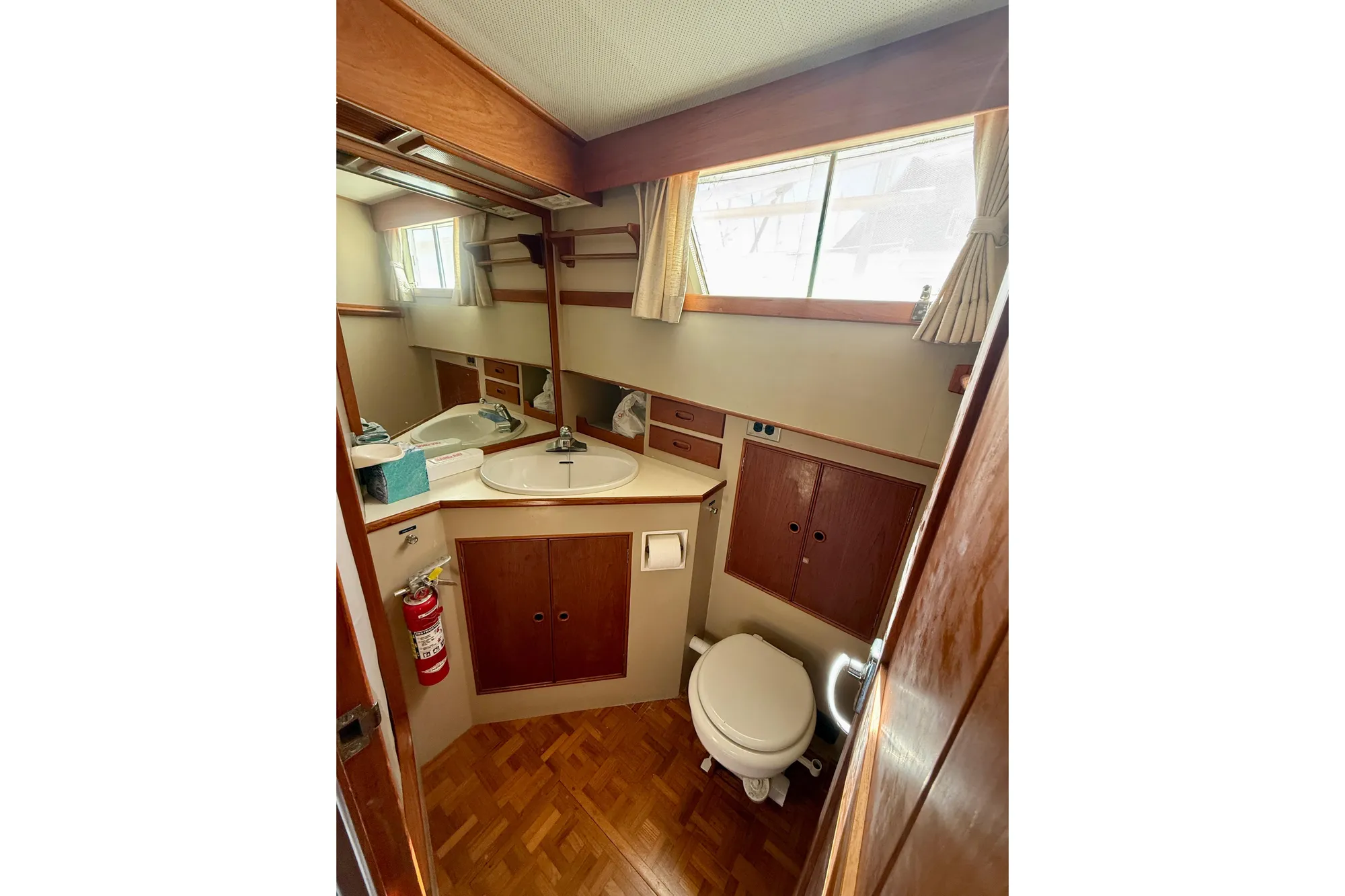 1982 Grand Banks 42 Classic yacht bathroom with wood accents and compact design.