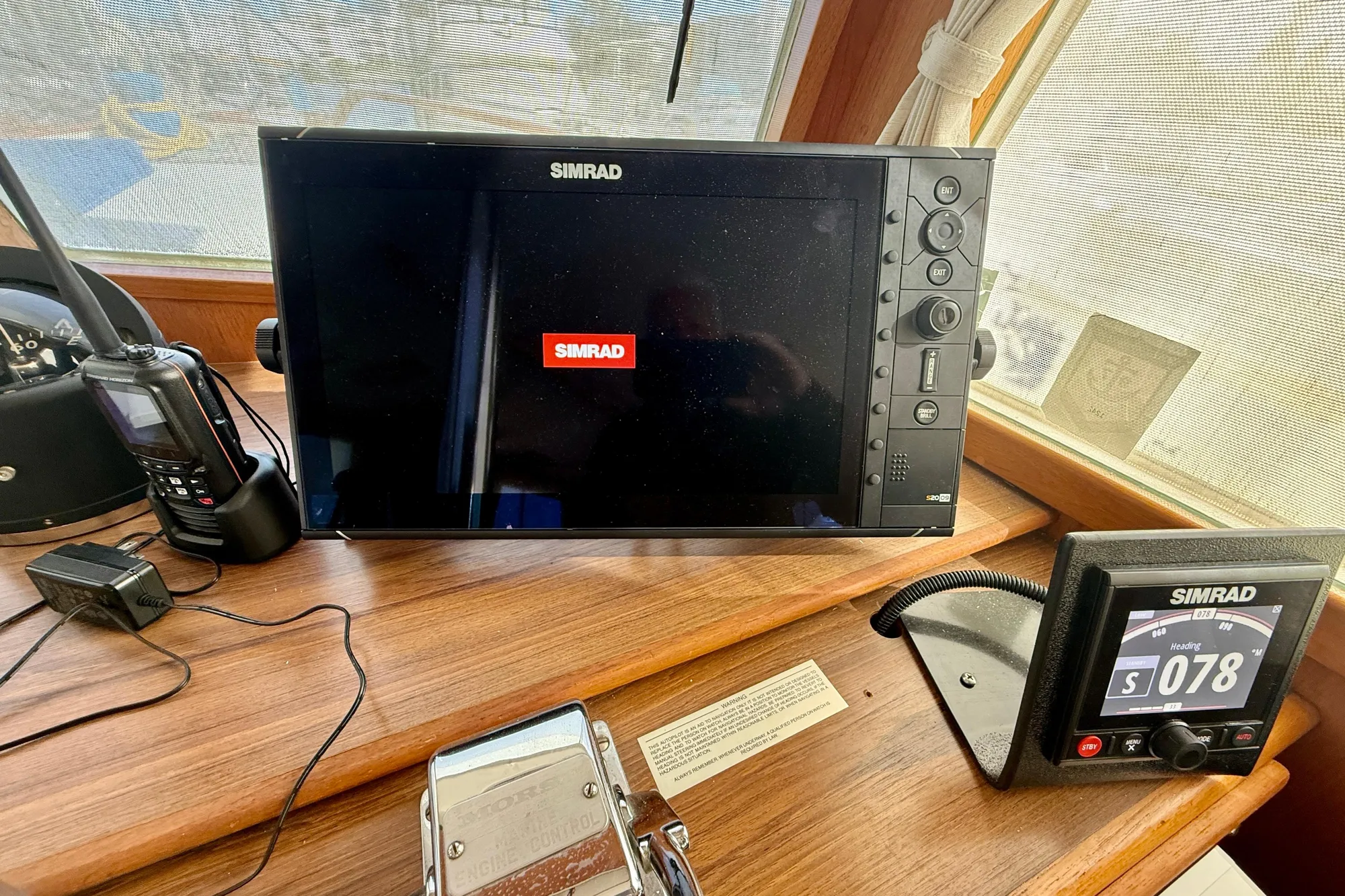 1982 Grand Banks Classic boat dashboard with Simrad navigation equipment.