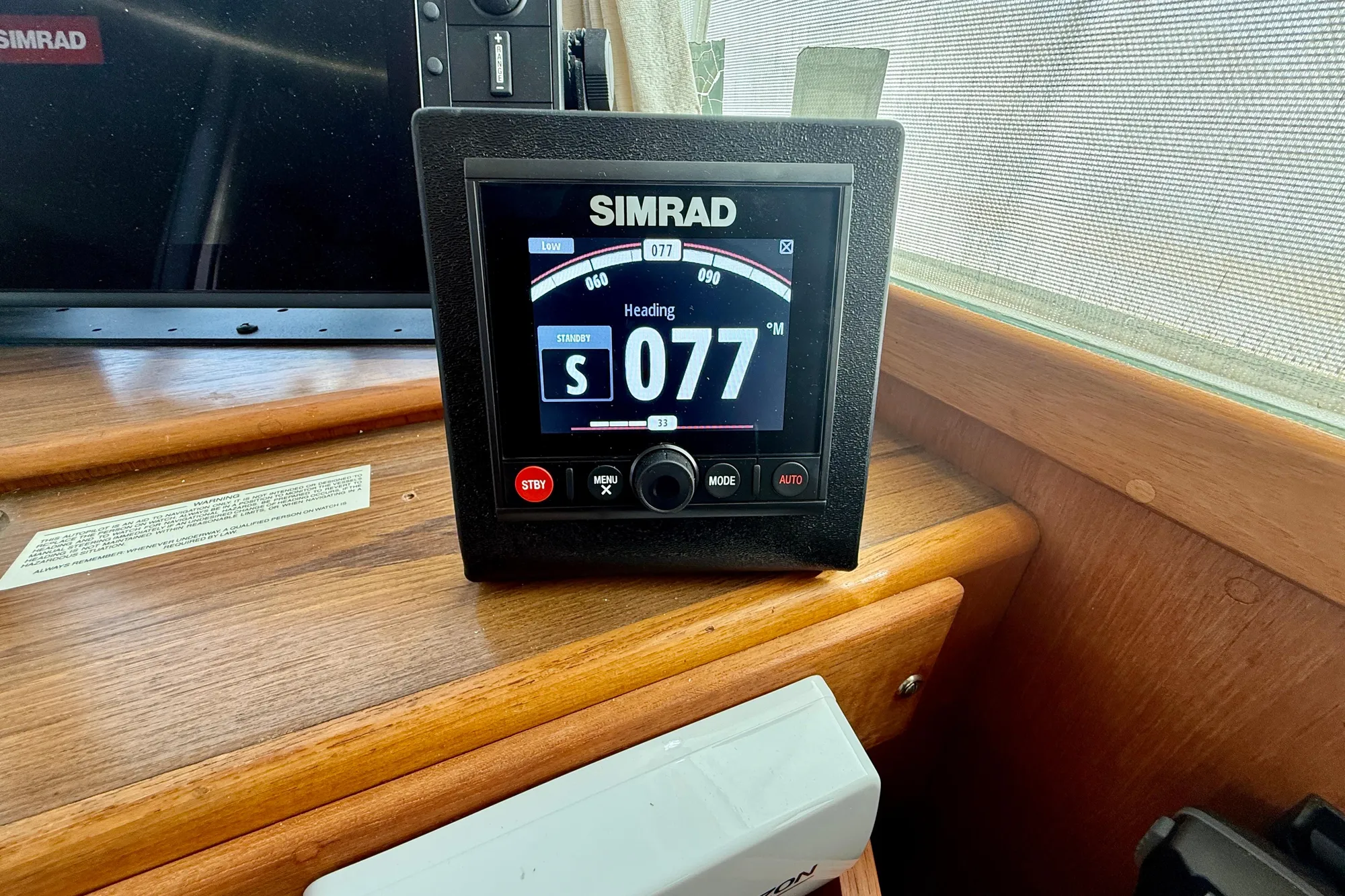 Simrad navigation display on 1982 Grand Banks Classic boat dashboard.