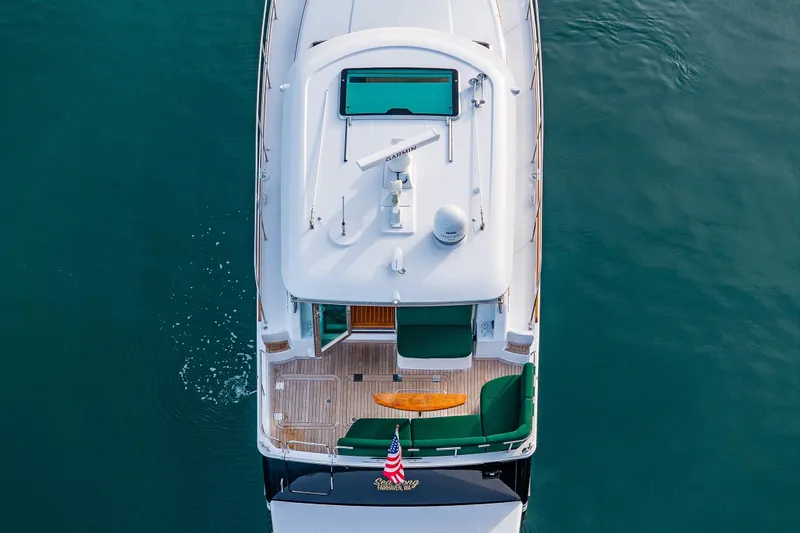 Sea Song Yacht Photos Pics Aerial view of 2019 Sabre 48 Salon Express yacht on calm water.