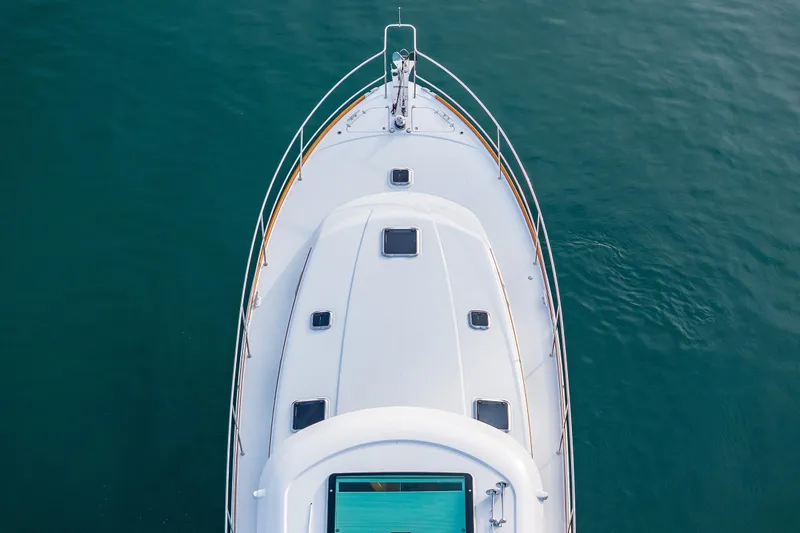 Sea Song Yacht Photos Pics Aerial view of 2019 Sabre 48 Salon Express yacht on calm water.