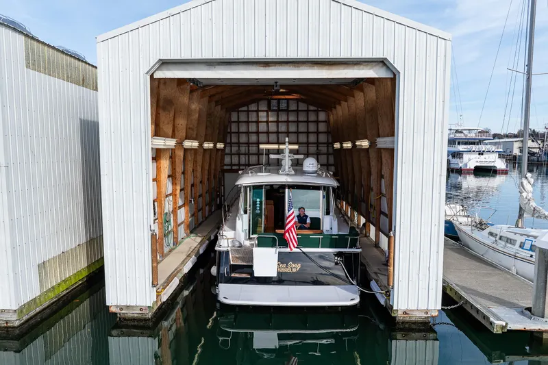 Sea Song Yacht Photos Pics 2019 Sabre 48 Salon Express yacht docked in a covered marina slip.