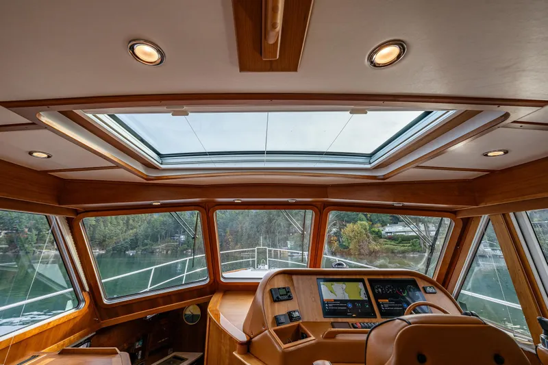 Sea Song Yacht Photos Pics Interior view of 2019 Sabre 48 Salon Express yacht helm with panoramic windows.