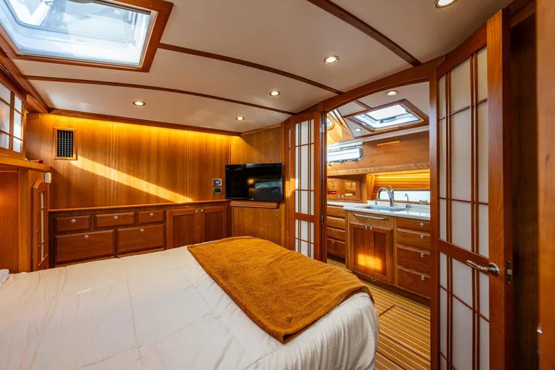 Sea Song Yacht Photos Pics Luxurious interior of 2019 Sabre 48 Salon Express yacht with wood finishes and skylights.
