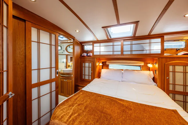 Sea Song Yacht Photos Pics Luxurious 2019 Sabre 48 Salon Express bedroom with wood accents and skylight.