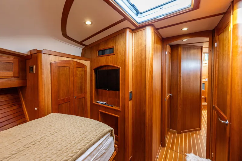 Sea Song Yacht Photos Pics Luxurious 2019 Sabre 48 Salon Express interior with elegant wood finish and cozy bedroom.