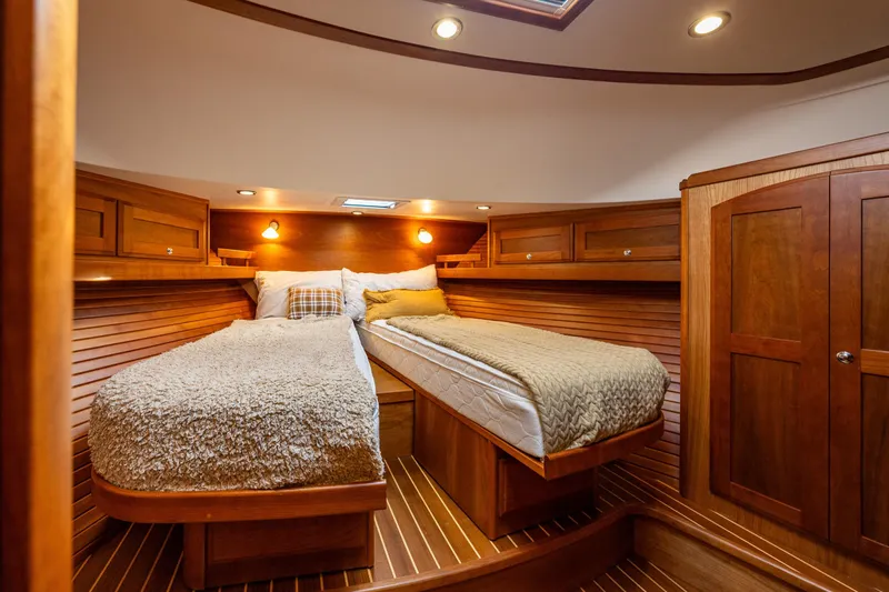 Sea Song Yacht Photos Pics Luxurious 2019 Sabre 48 Salon Express cabin with twin beds and elegant wood finish.