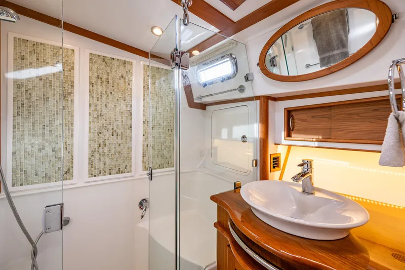 Sea Song Yacht Photos Pics Luxurious bathroom in 2019 Sabre 48 Salon Express yacht with modern fixtures and elegant design.