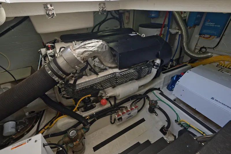 Sea Song Yacht Photos Pics Engine room of 2019 Sabre 48 Salon Express yacht, showcasing mechanical components.