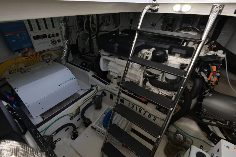 Sea Song Yacht Photos Pics Engine room of 2019 Sabre 48 Salon Express with visible machinery and equipment.