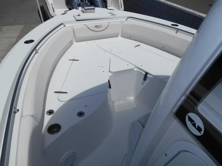  Yacht Photos Pics 2019 Sea Hunt Ultra 235 SE boat interior, featuring spacious seating and storage areas.