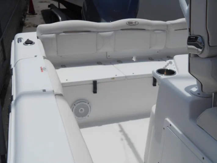  Yacht Photos Pics 2019 Sea Hunt Ultra 235 SE boat interior with white seating and storage compartments.