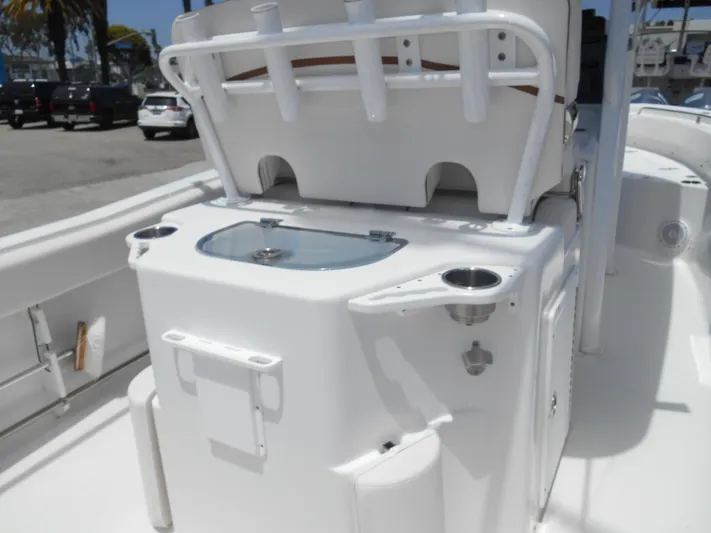  Yacht Photos Pics 2019 Sea Hunt Ultra 235 SE boat interior with fishing rod holders and storage compartments.