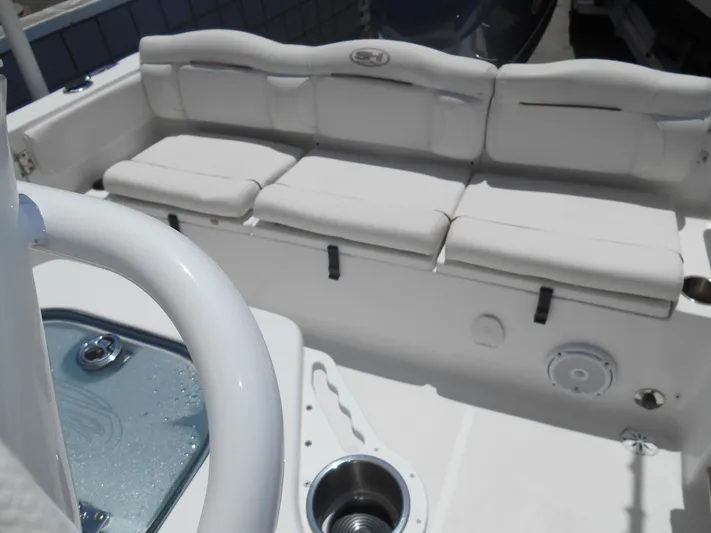  Yacht Photos Pics 2019 Sea Hunt Ultra 235 SE boat interior with cushioned seating and storage compartments.