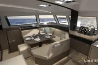 2025 Nautitech 44 Open yacht interior with dining area and navigation equipment.