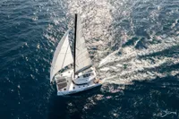 2025 Nautitech 44 Open catamaran sailing on open sea, aerial view.