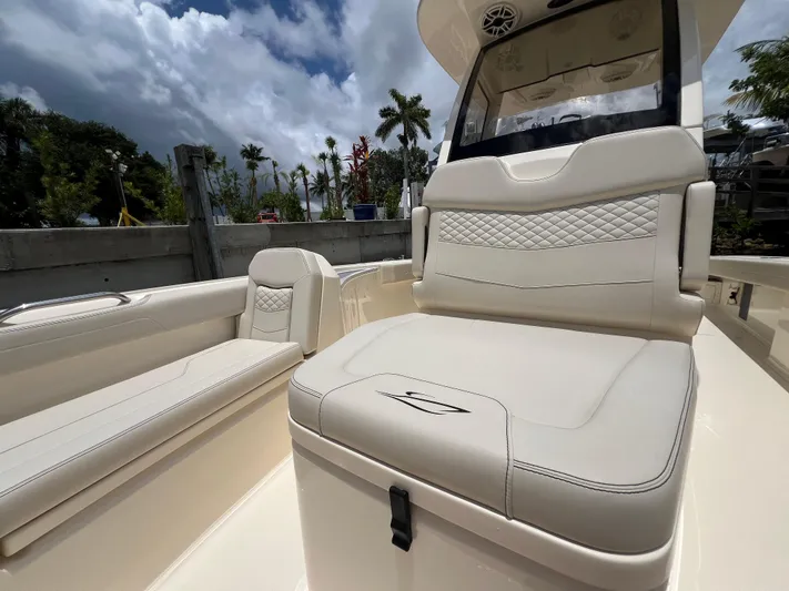  Yacht Photos Pics 2025 Scout 281 XSS boat interior with luxurious seating and modern design.