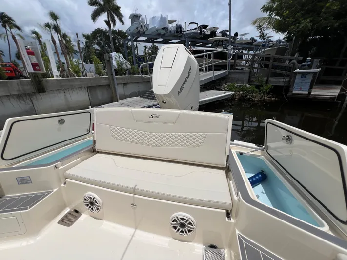  Yacht Photos Pics 2025 Scout 281 XSS boat interior with seating and storage compartments.