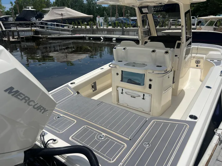  Yacht Photos Pics 2025 Scout 281 XSS boat with Mercury engine, docked at marina.