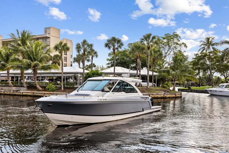 Happy 2 Gether Yacht Photos Pics 2021 Formula 380 Super Sport Crossover OB on a sunny waterway.