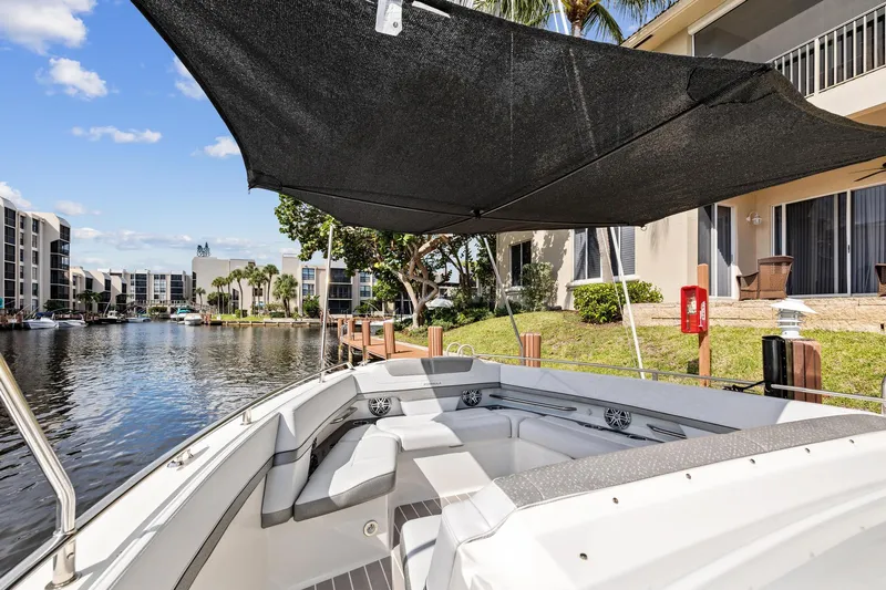 Happy 2 Gether Yacht Photos Pics 2021 Formula 380 Super Sport Crossover OB by the water, with sunshade.