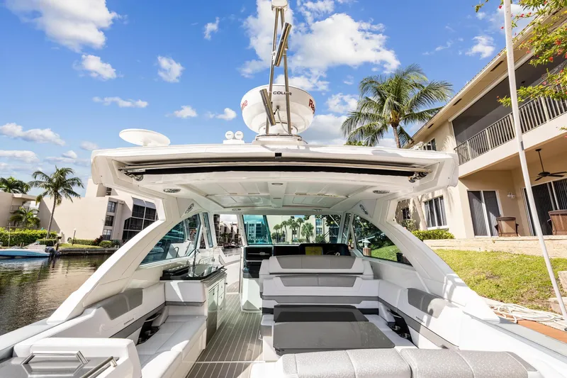 Happy 2 Gether Yacht Photos Pics 2021 Formula 380 Super Sport Crossover OB on a sunny waterway.