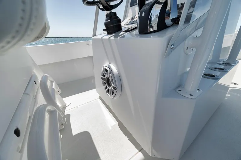  Yacht Photos Pics 2004 Contender 25 Tournament boat interior with console and speaker, ocean in background.